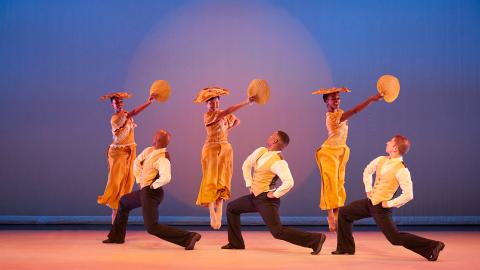 Alvin Ailey American Dance Theater in Alvin Ailey's Revelations. Photo by Dario Calmese.