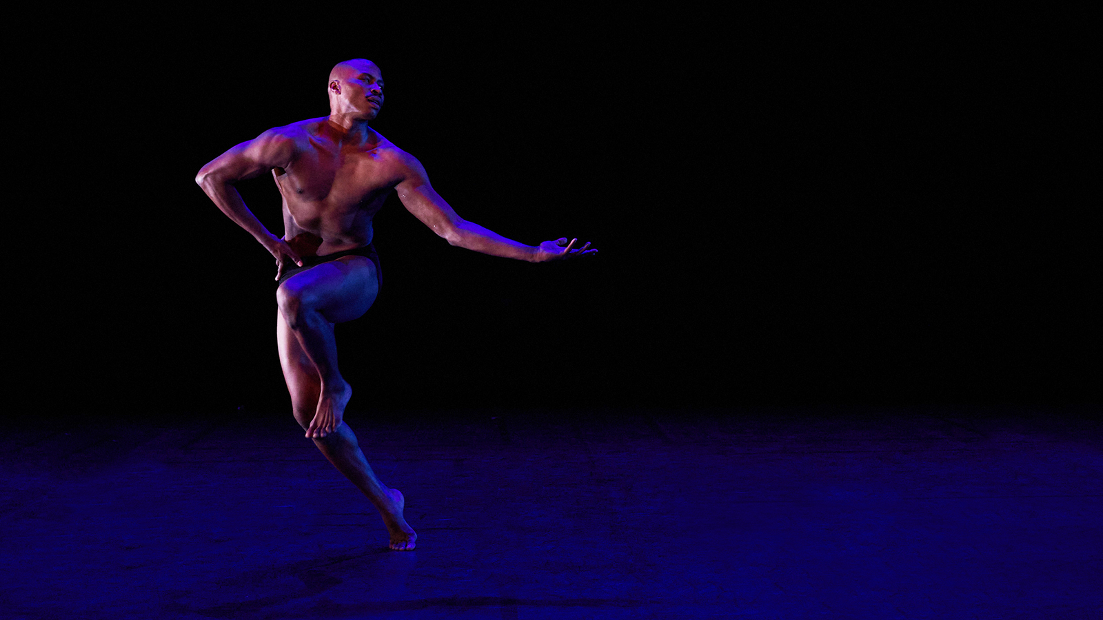 Alvin Ailey American Dance Theater's Jeroboam Bozeman in Robert Battle's In/Side. Photo by Dario Calmese.